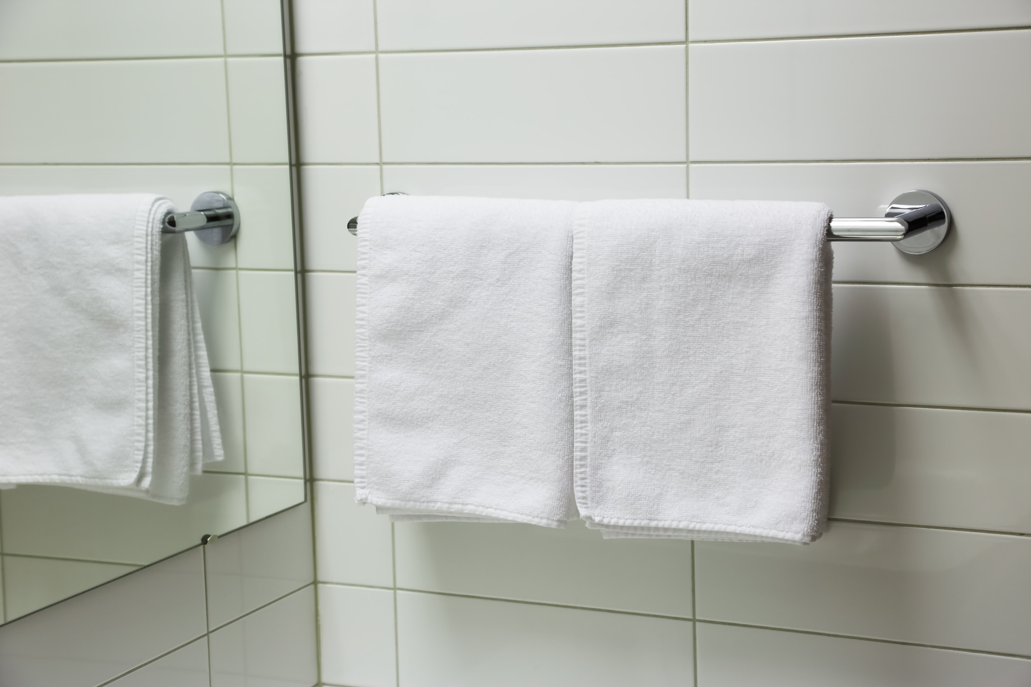 two folded towels on towel rail