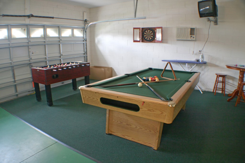 A garage with a Games Room Theme 