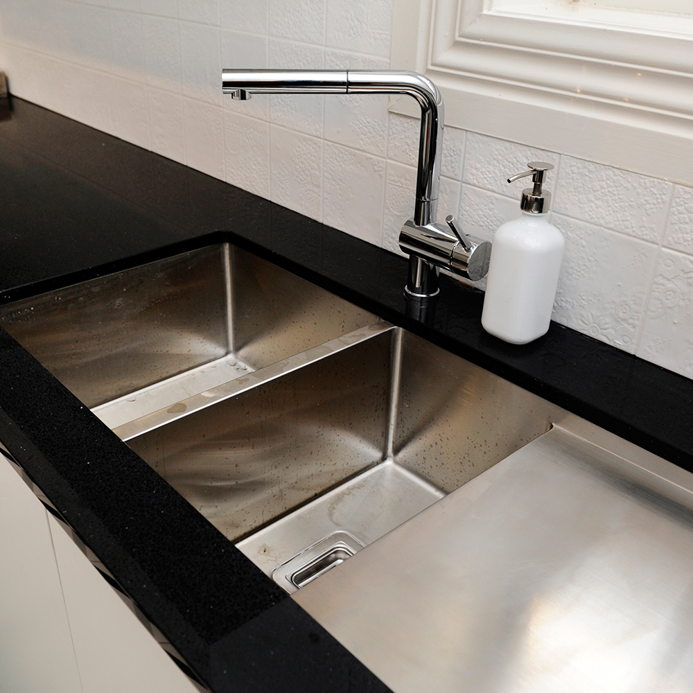 stainless-steel-sink-black-countertop
