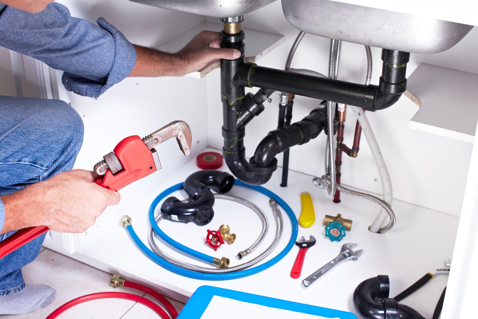 plumber hands with a wrench