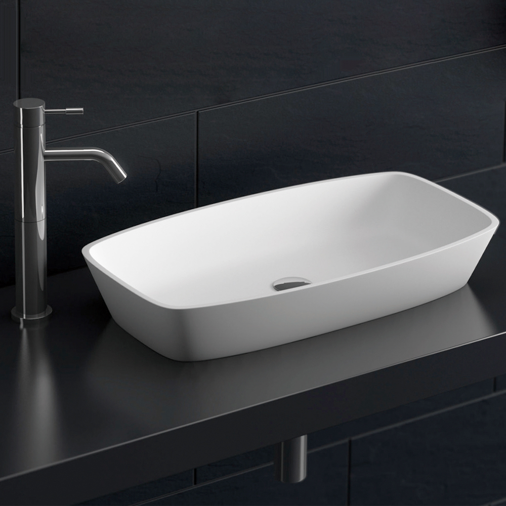 Aguzzo Brennero rounded rectangle limestone white bathroom basin on black benchtop
