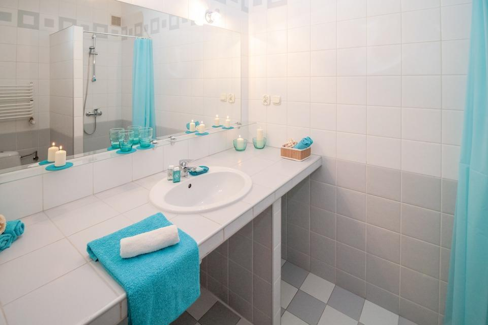 white and grey bathroom mirror sink towel
