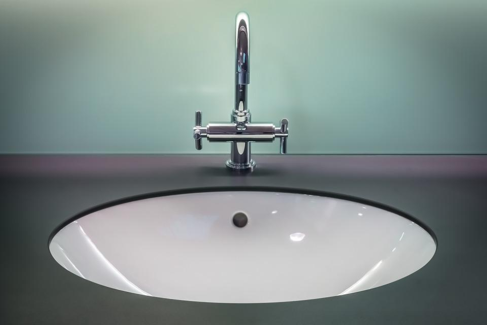 ceramic bathroom basin with chrome mixer tap