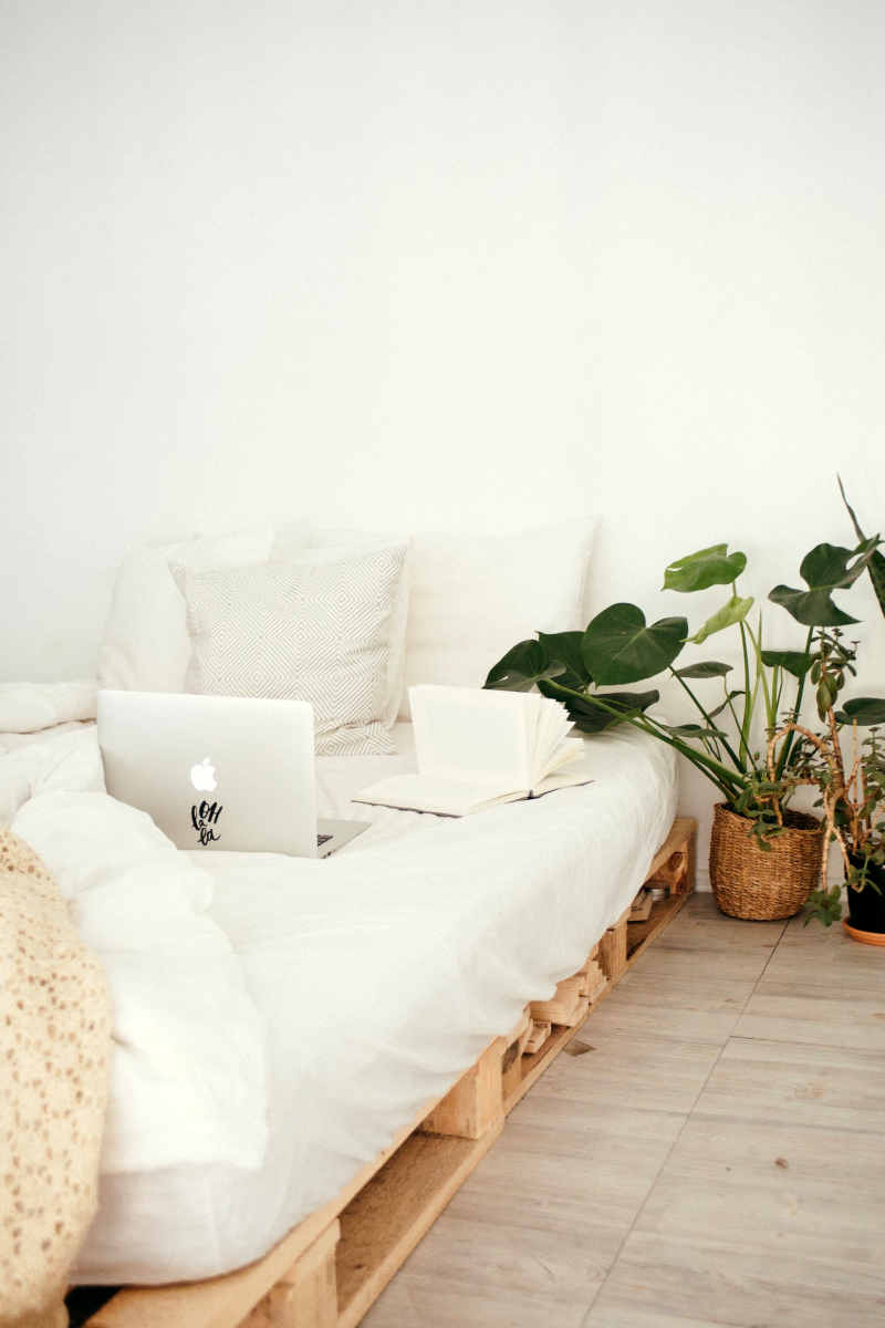 make a bedroom look bigger bedroom with white and crate bed