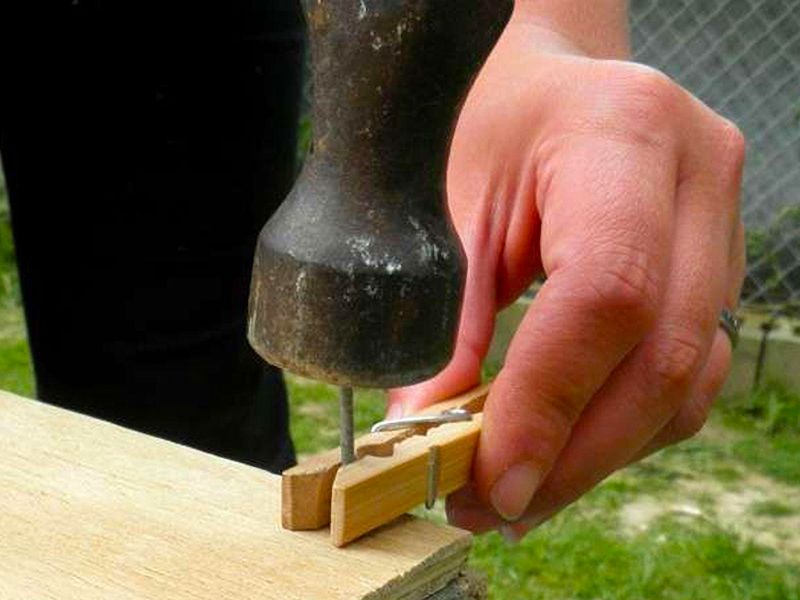 Hammer Safely with a Clothespeg hammer with clothespin holding nail in place