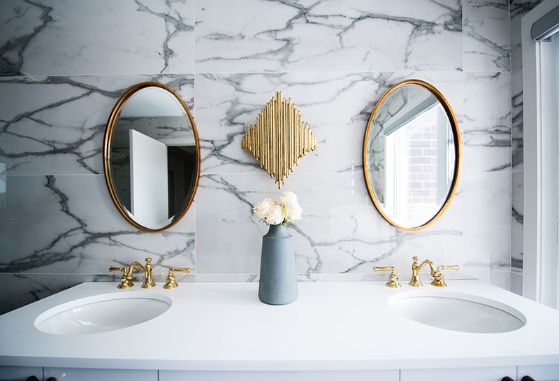 White and Gold Bathroom inspecting home plumbing