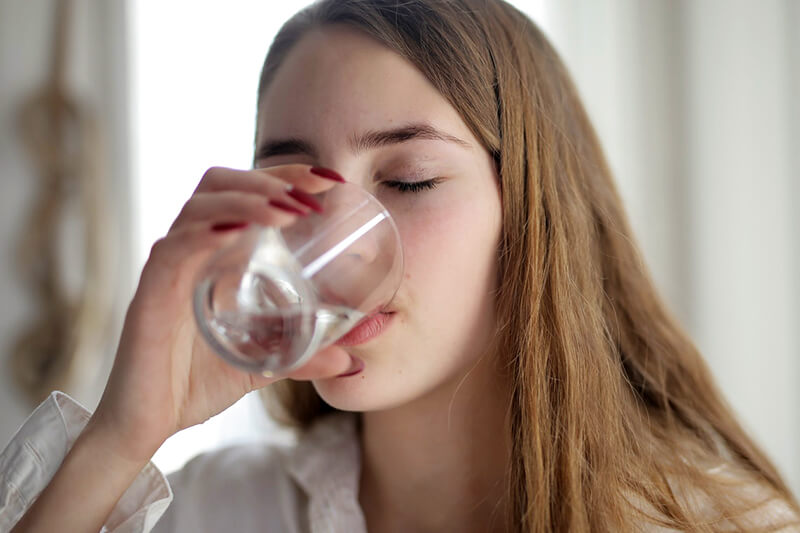 Woman Drinking Water Home Water Filtration