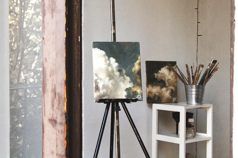 Spare Room turned into Art Studio art easel and paint brushes in art studio