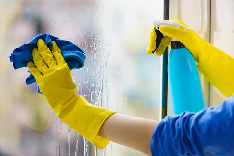 cleaning window with disinfectant